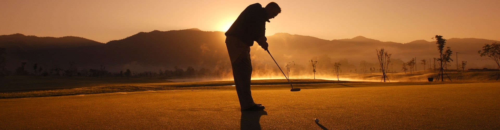 Golfer im Abendlicht